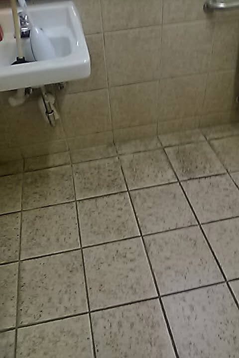 Carpet and tile cleaning in Surprise, AZ by Johnson Carpet Cleaning: a dirty tile floor with dark grout lines