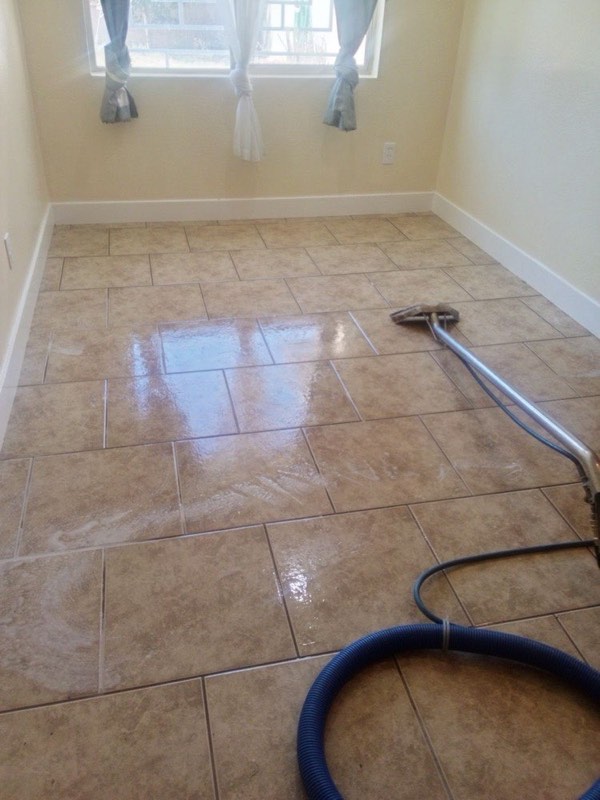 Shiny clean tile floor with a cleaning wand