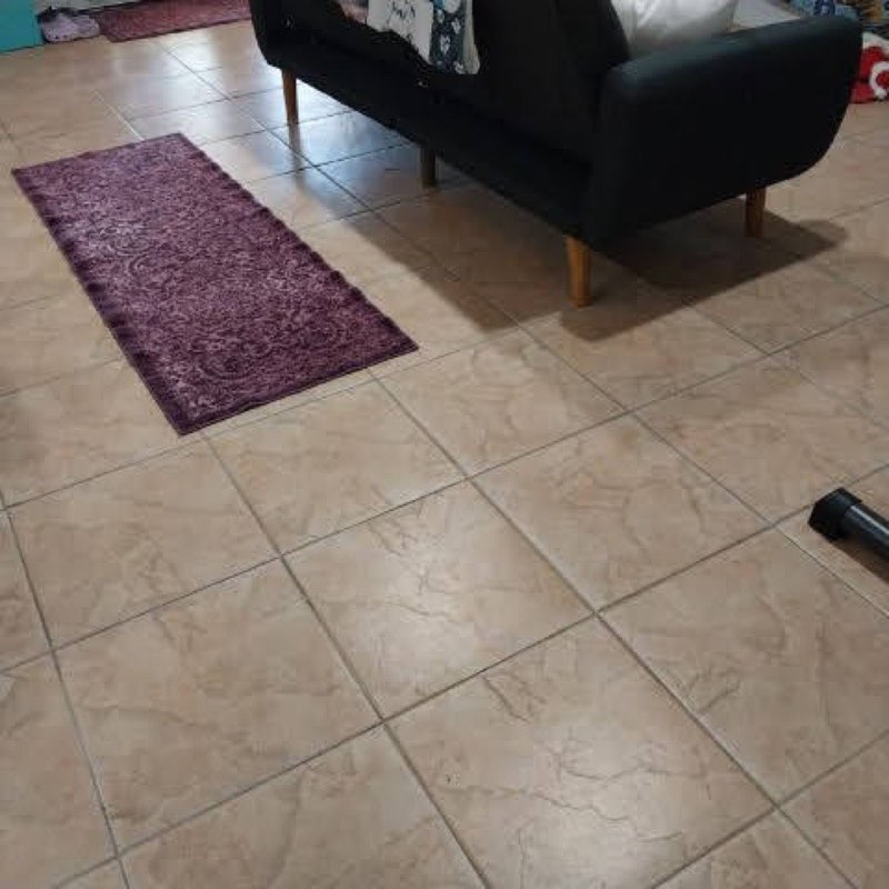 Clean tile floor with a runner rug